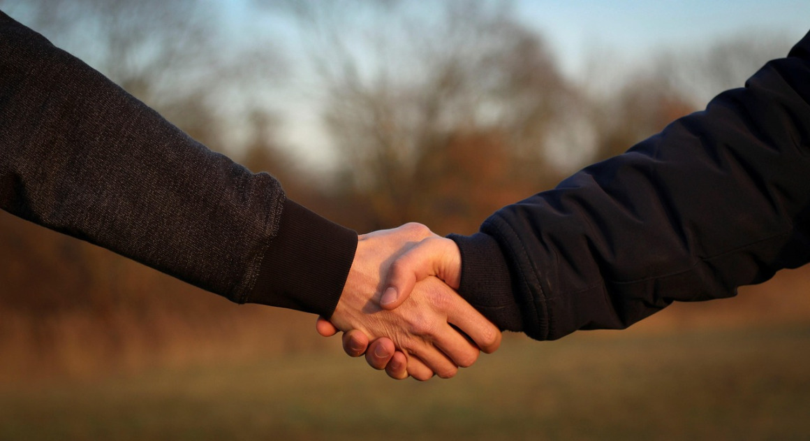 industrial handshake partnership material handling rep